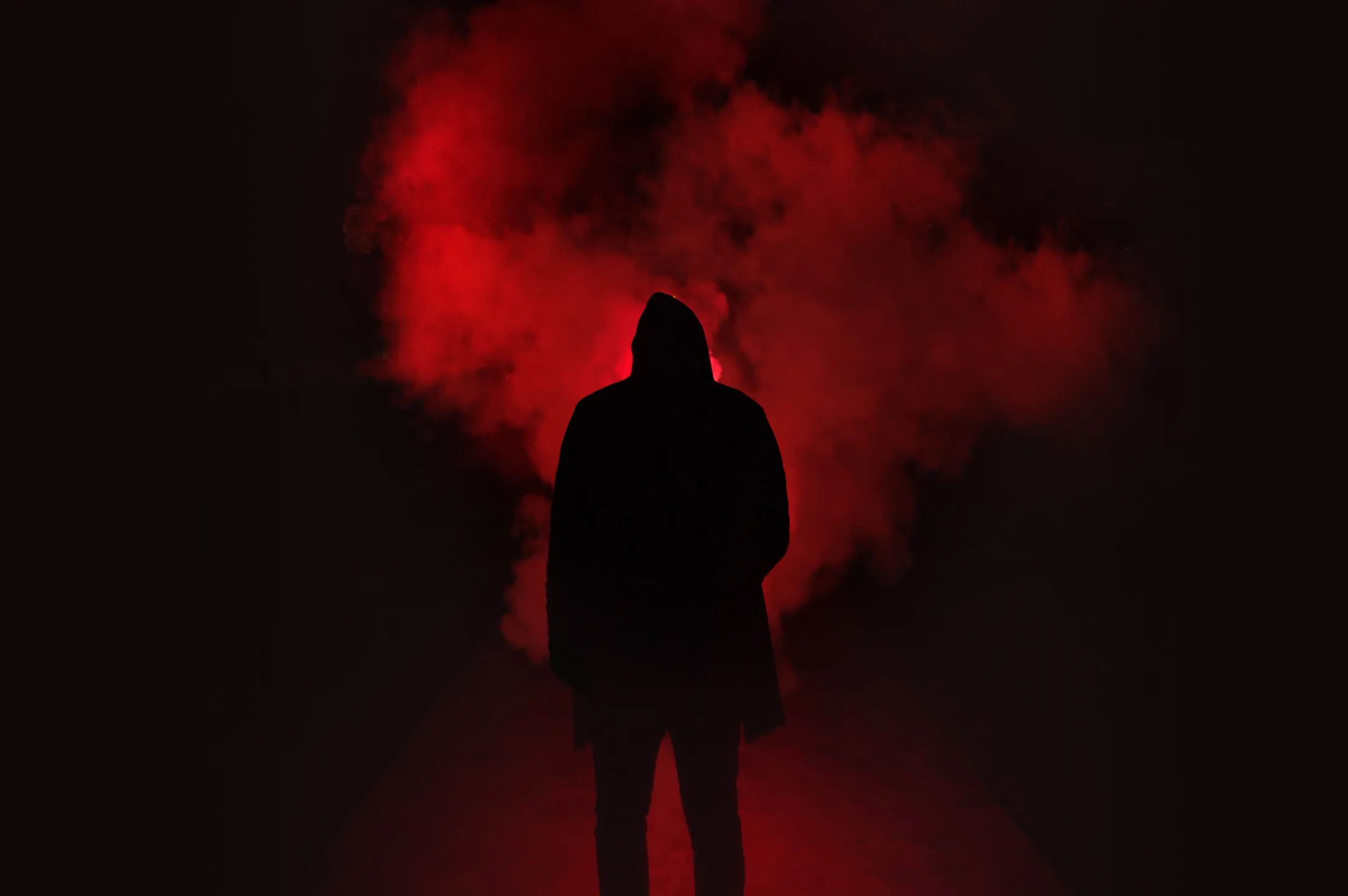 man on red smoke background