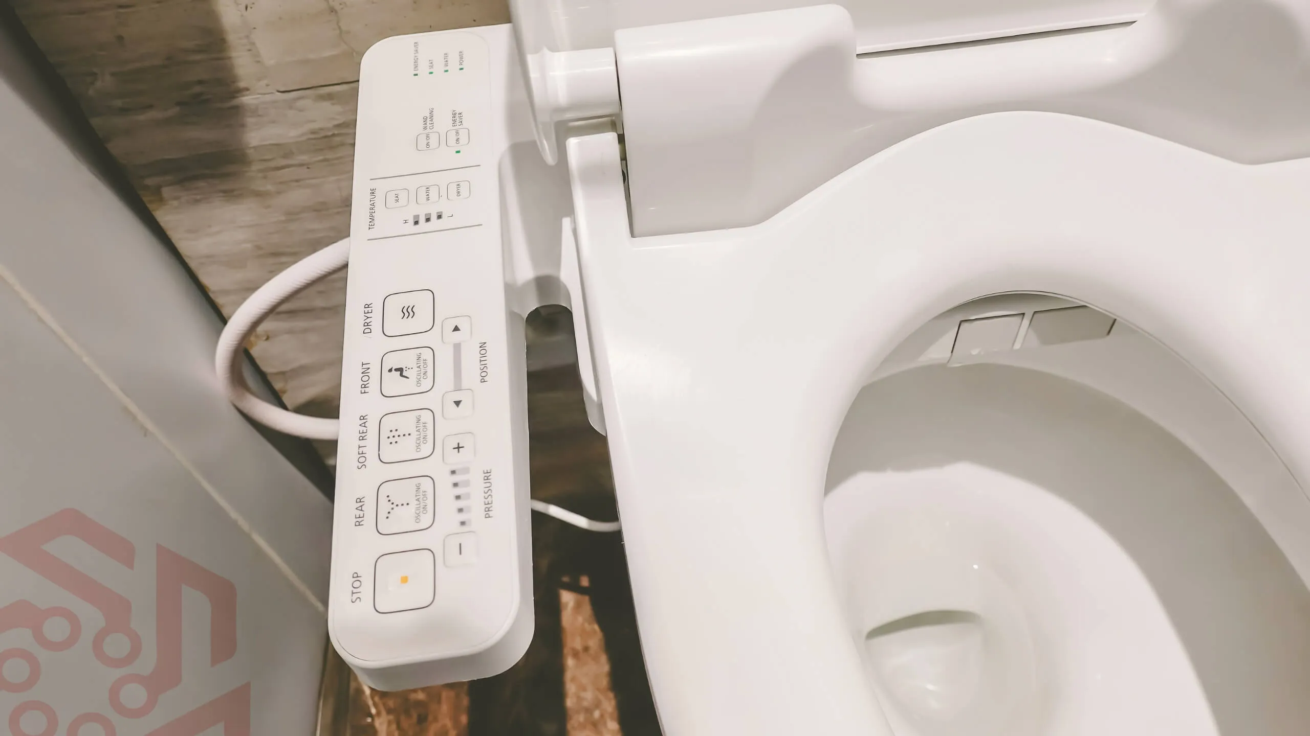 Example of smart toilet with control on the seat