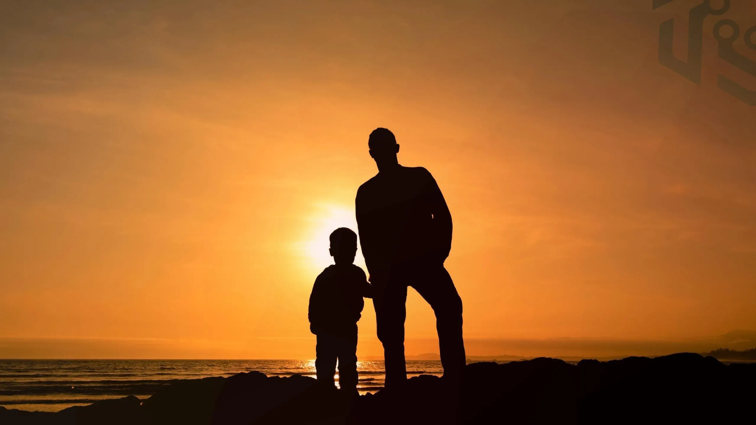 Father and son on the sunset