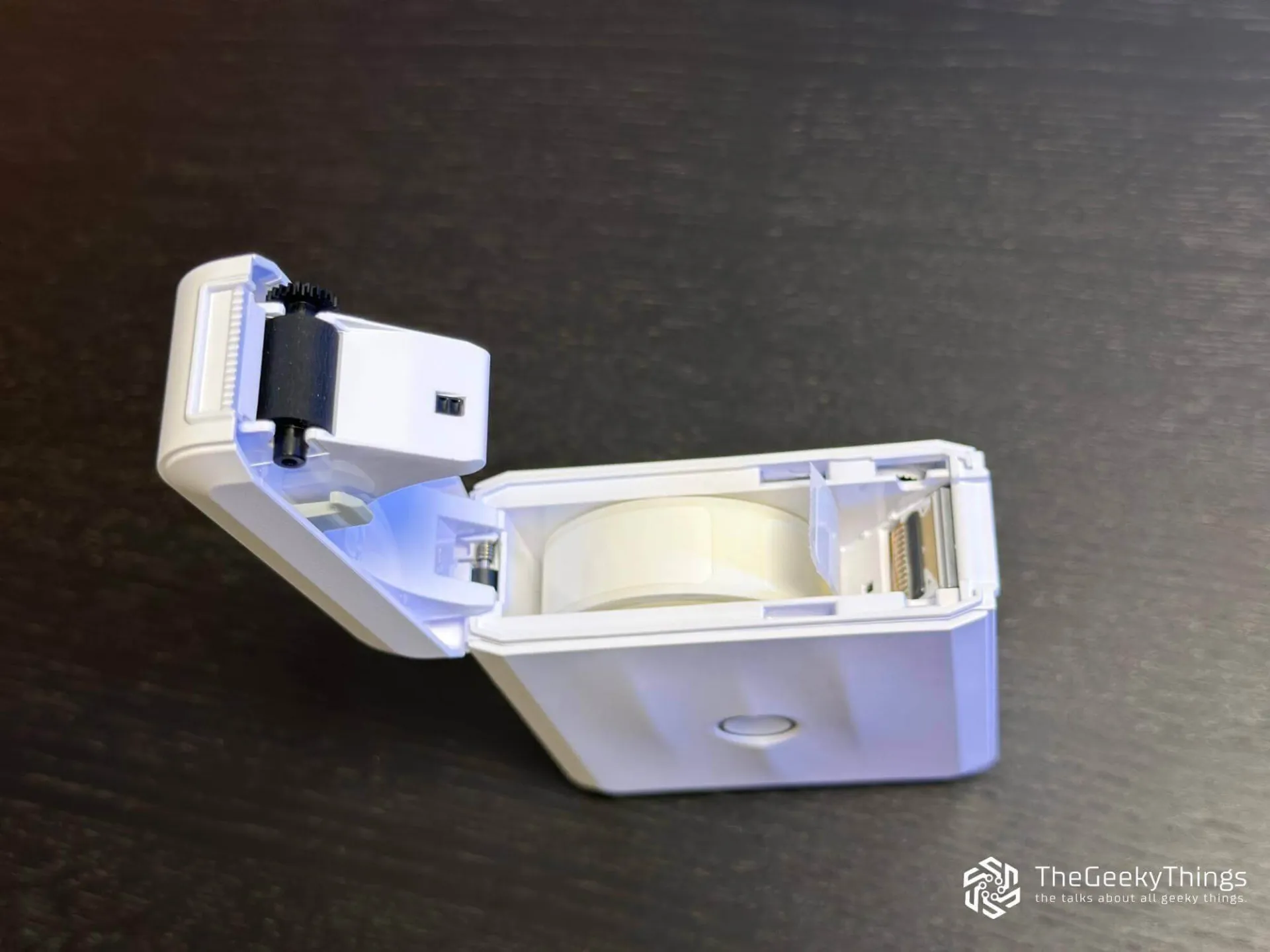 Niimbot D110 printer with open cover above view