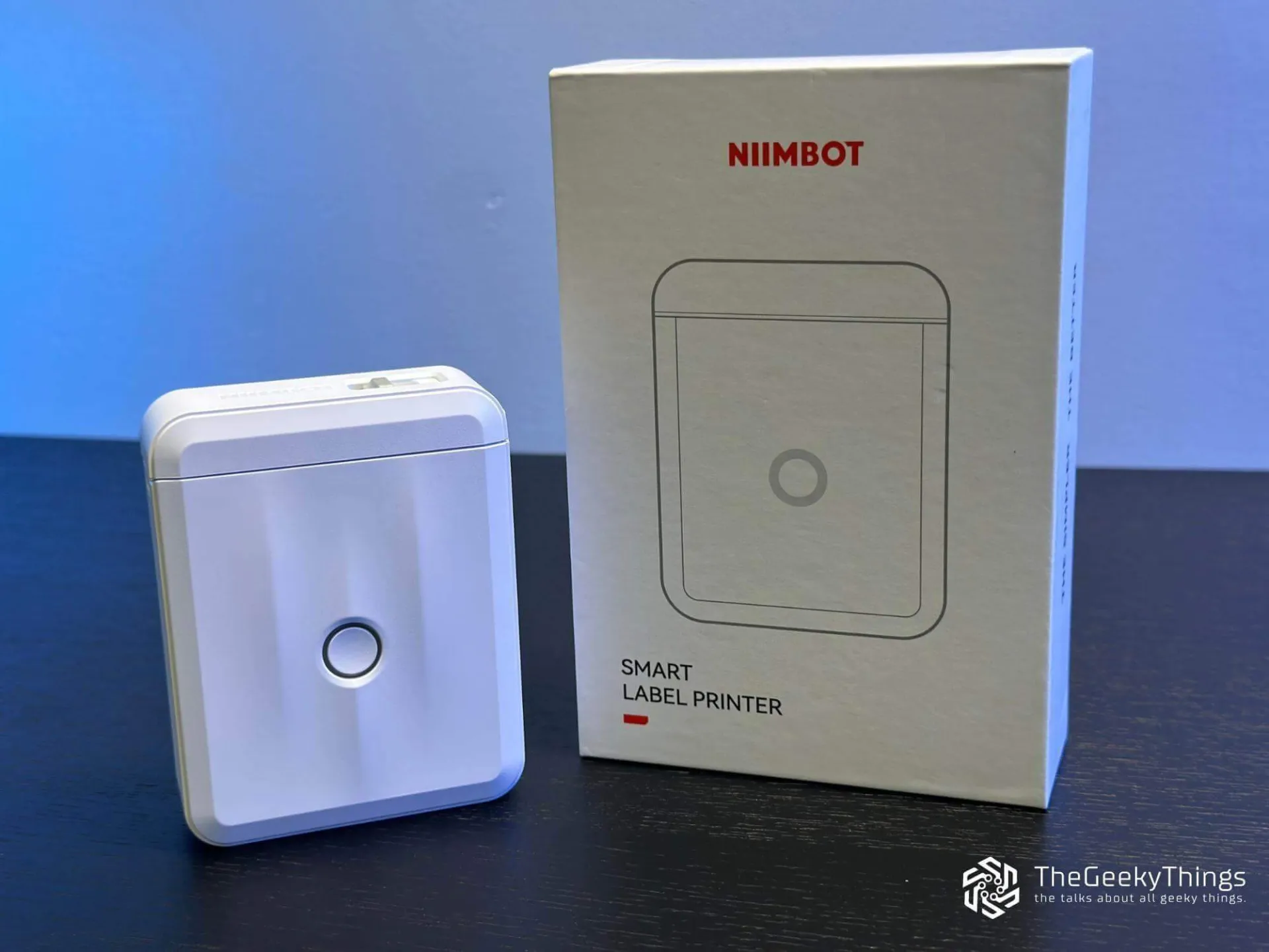 Niimbot label maker D110 and its box on the desk