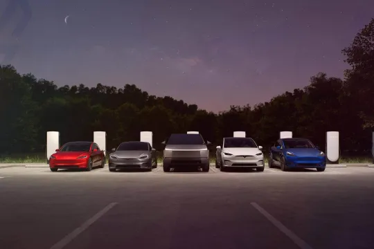 All Tesla vehicles near chargers at the night