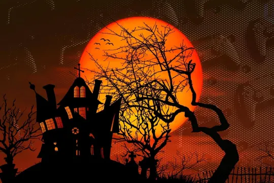 Halloween Theme with scary house and game controllers as background