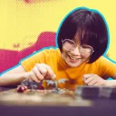 Asian girl playing d&d with pop art background