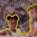 Two preschool girls playing the board game